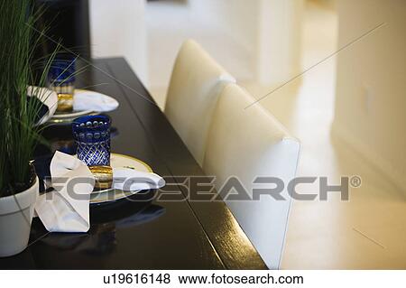 Stock Photo - Contemporary Dining Scene with Place Settings. Fotosearch