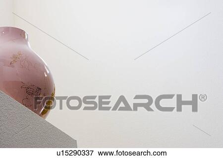 Stock Photo - Contemporary Vase Sitting on Built In Architectural Display. Fotosearch