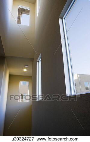 Stock Photo - Dark Stairwell with High Ceilings and Windows. Fotosearch