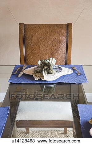 Detail of a place setting on a glass table View Large Photo Image Stock Photo - Detail of a place setting on a glass table. Fotosearch