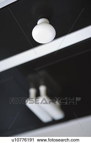 Stock Image - Detail of black drawers with white handles, close up. Fotosearch