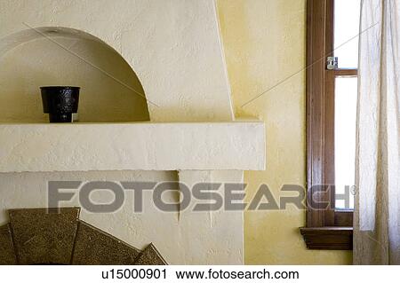 Stock Image - Detail of fireplace mantel.. Fotosearch