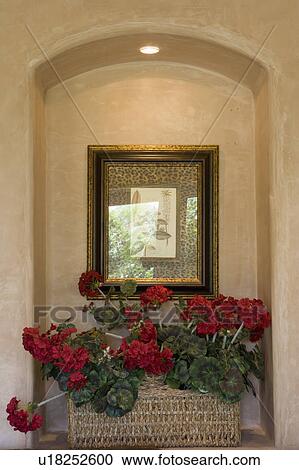 Stock Image - Detail of inset with red flowers and painting. Fotosearch