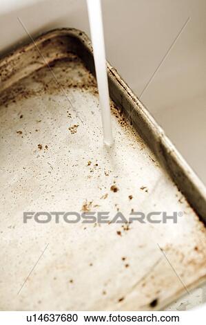 Detail of running water on a dirty cookie sheet View Large Photo Image Stock Image - Detail of running water on a dirty cookie sheet. Fotosearch