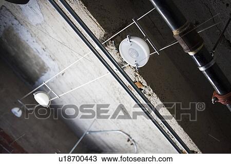 Detail of strip lighting in industrial setting View Large Photo Image Stock Image - Detail of strip lighting in industrial setting. Fotosearch