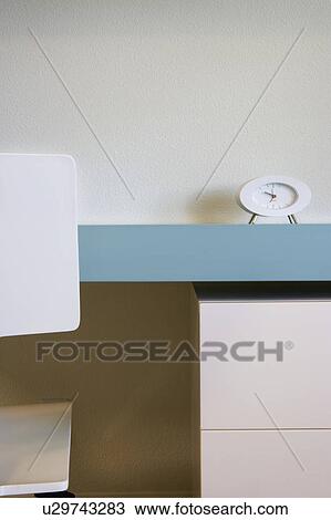 Stock Image - Modern Blue Desk and White Chair. Fotosearch