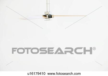 Stock Image - Modern Ceiling Fan in Motion. Fotosearch