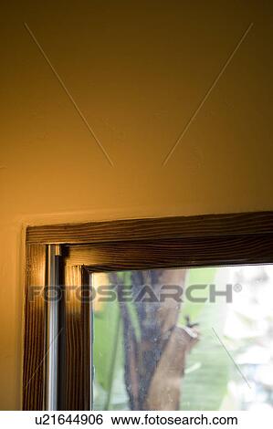 Stock Photograph - Orange Wall and Window with Wood Trim. Fotosearch