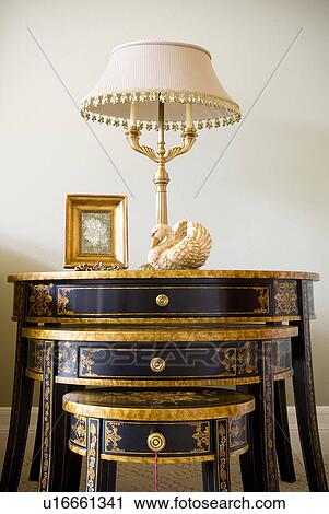 Stock Image - Stacked Side Tables and Lamp. Fotosearch