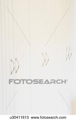 Stock Image - White Cabinets and Handles. Fotosearch
