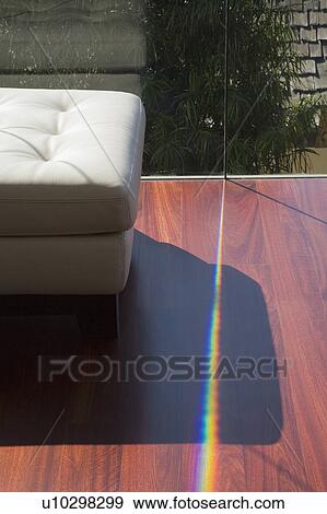 Stock Photo - White Leather Ottoman and Hardwood Floor. Fotosearch