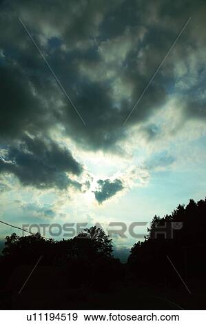 Stock Photo - Clouds over field in Biei, Hokkaido, Japan. Fotosearch