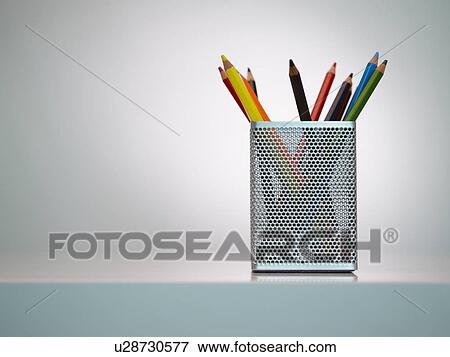 Stock Photo - Colour pencils in pot, close up. Fotosearch