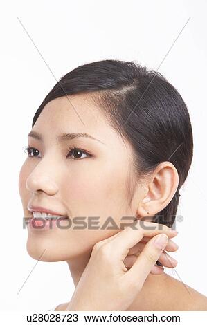 Portrait of Natural Young girl with hands next to face View Large Photo Image Stock Image - Portrait of Natural Young girl with hands next to face. Fotosearch