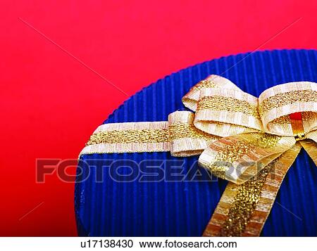 Round shaped box with golden bow, Close-up View Large Photo Image Stock Image - Round shaped box with golden bow, Close-up. Fotosearch