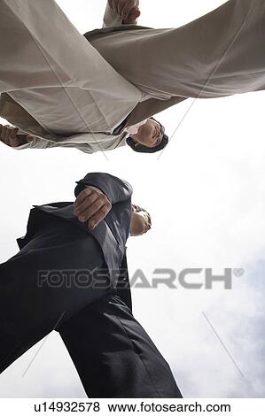 Stock Photo - Businessmen and sky. Fotosearch