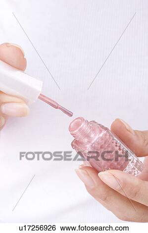 Stock Photograph - Hand to paint with manicure. Fotosearch