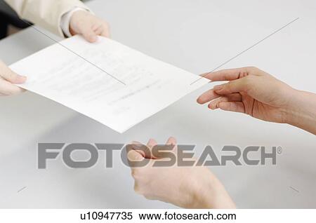 Hands delivering a contract View Large Photo Image Stock Photography - Hands delivering a contract. Fotosearch