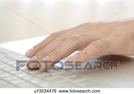 Stock Photo - Keyboard and hand. Fotosearch