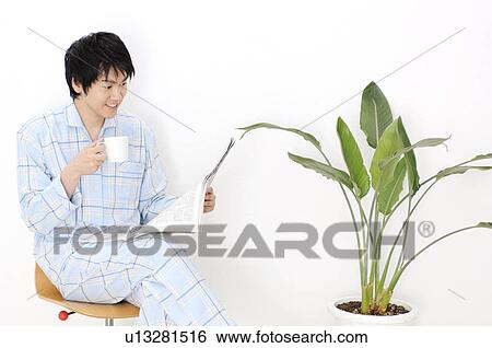 Stock Photograph - Man reading newspaper. Fotosearch