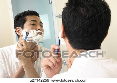 Man shaving in a mirror View Large Photo Image Stock Photo - Man shaving in a mirror. Fotosearch