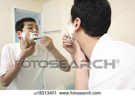 Stock Image - Man shaving. Fotosearch