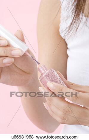 Painting fingernails View Large Photo Image Stock Photo - Painting fingernails. Fotosearch