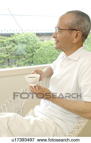 Stock Photo - Relaxing elderly male. Fotosearch
