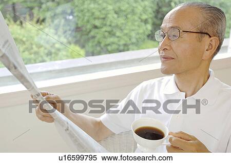 Senior who reads a newspaper View Large Photo Image Stock Photography - Senior who reads a newspaper. Fotosearch
