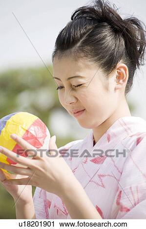 Woman in a Yukata with a paper balloon View Large Photo Image Stock Image - Woman in a Yukata with a paper balloon. Fotosearch