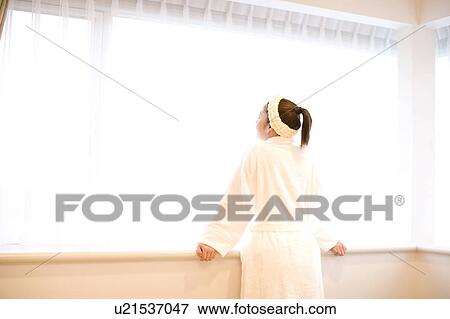 Woman in bathrobe View Large Photo Image Stock Photo - Woman in bathrobe. Fotosearch