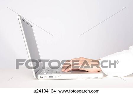 Woman's hands operating the laptop View Large Photo Image Picture - Woman's hands operating the laptop. Fotosearch