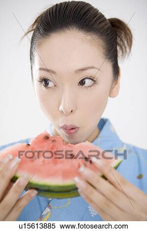 Yukata woman who eats a watermelon View Large Photo Image Stock Photography - Yukata woman who eats a watermelon. Fotosearch