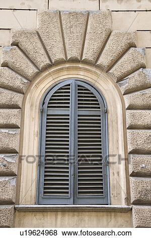Arched window with closed shutters in Rome, Italy View Large Photo Image Stock Photo - Arched window with closed shutters in Rome, Italy. Fotosearch