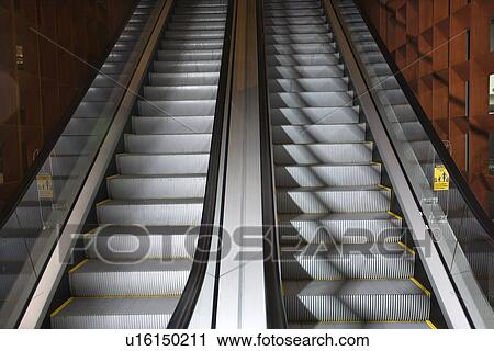 Ascending and descending escalators View Large Photo Image Stock Image - Ascending and descending escalators. Fotosearch