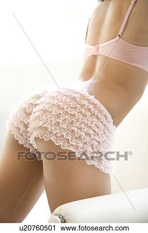 Download Back side of young adult woman wearing pink lingerie ...
