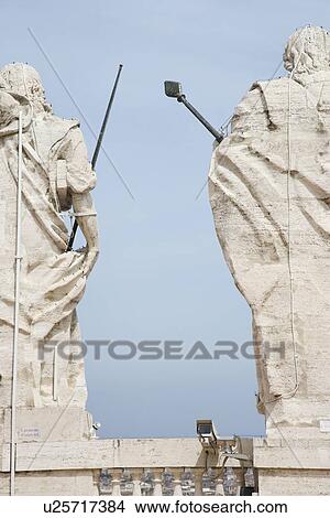 Back view of Roman statues with blue sky in Rome, Italy. View Large Photo Image Picture - Back view of Roman statues with blue sky in Rome, Italy.. Fotosearch