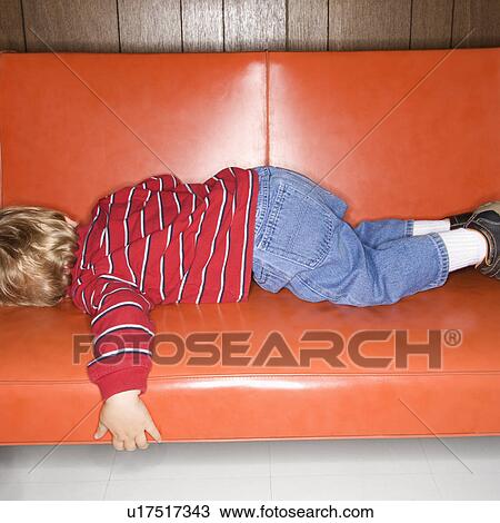 Boy sleeping on vinyl sofa View Large Photo Image Stock Image - Boy sleeping on vinyl sofa. Fotosearch