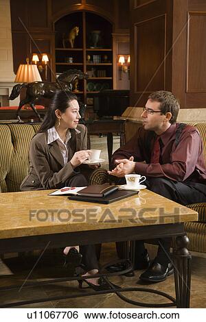 businessman and woman drinking coffee View Large Photo Image Stock Photograph - businessman and woman drinking coffee . Fotosearch