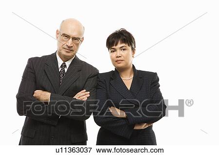 Stock Photo - businesspeople standing with arms crossed. Fotosearch