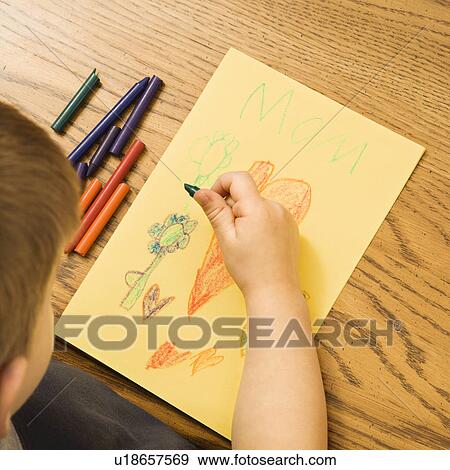 Caucasian boy drawing on paper with crayons. View Large Photo Image Stock Photo - Caucasian boy drawing on paper with crayons.. Fotosearch