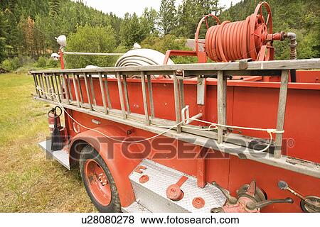 Stock Photo - Close-up of old fire truck and ladder. Fotosearch