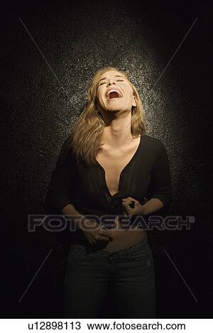 Dark portrait of sexy mid-adult woman with head back laughing View Large Photo Image Stock Image - Dark portrait of sexy mid-adult woman with head back laughing. Fotosearch