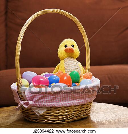Easter basket holding eggs and yellow duck View Large Photo Image Stock Image - Easter basket holding eggs and yellow duck. Fotosearch