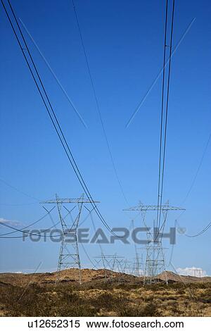 Electrical power lines in barren desert landscape View Large Photo Image Stock Photography - Electrical power lines in barren desert landscape. Fotosearch