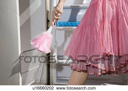 Feather dusting empty refrigerator View Large Photo Image Stock Image - Feather dusting empty refrigerator. Fotosearch