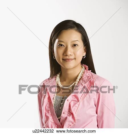 Female smiling and looking at viewer View Large Photo Image Stock Image - Female smiling and looking at viewer. Fotosearch