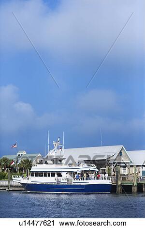 Stock Image - Ferry boat docked at port on Bald Head Island, North Carolina. Fotosearch