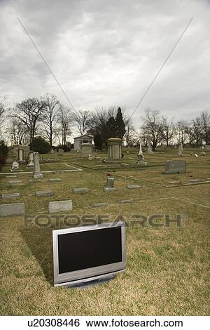 Stock Photograph - Flat panel television set in cemetery. Fotosearch