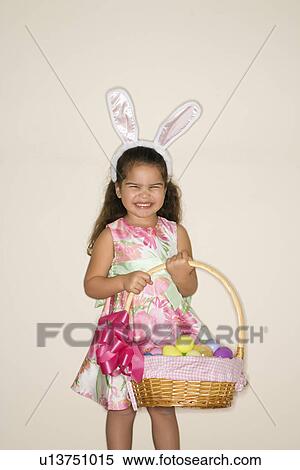 Stock Photography - Girl wearing bunny ears . Fotosearch